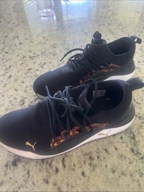 Puma Black Sneakers with Gold Logo and Tortoiseshell Trim